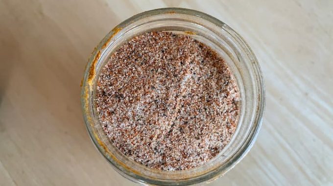 Pour the seasoning mix into a jar or shaker of your choice. I'm using a recycled mason jar.