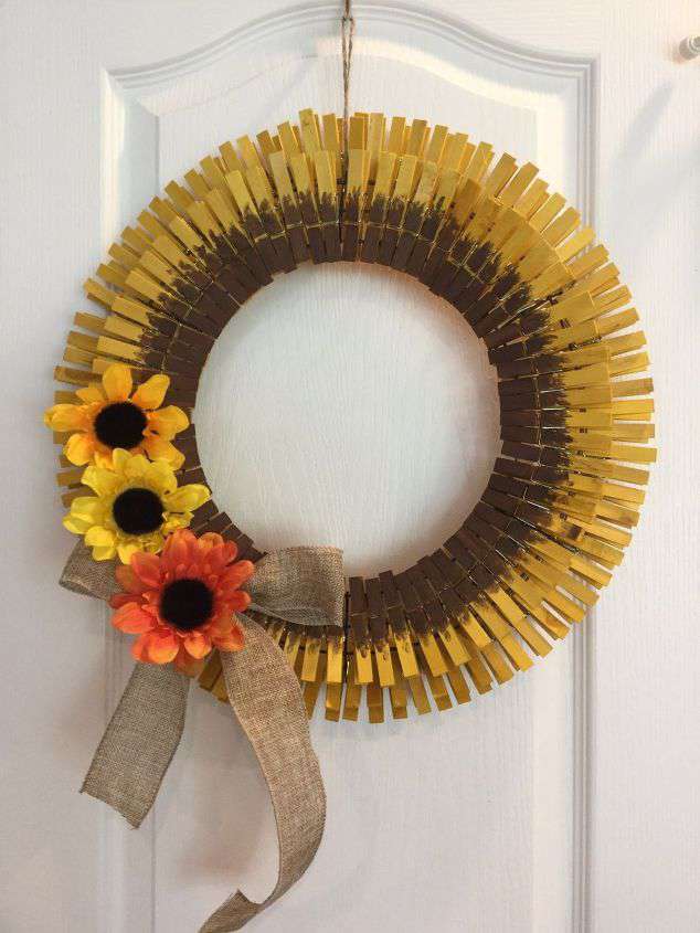 A little Rit Dye, some clothes pins, a wreath form, and a few finishing touches and you have a sunflower wreath. Its' inexpensive and easy to make your own easy clothespin sunflower wreath. #clothespinsunflowerwreath #chascrazycreations #diysunflowerwreath