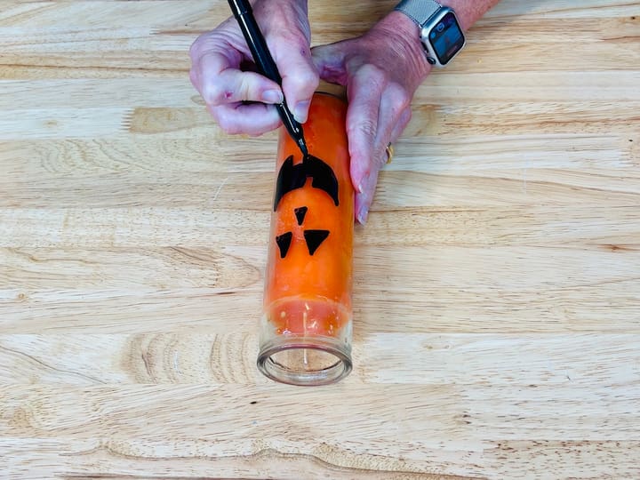  for my orange candle, I drew on a jack o lantern face. 