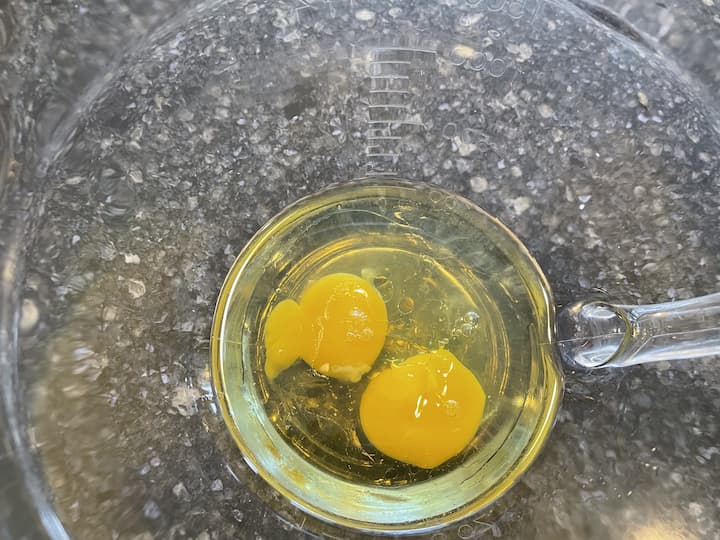 1.  Place 2 eggs and 1/2 cup oil in a bowl