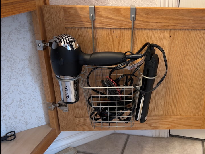I purchase a different basket that would hold a blow dryer and flat iron.  What was important with this basket is the ability to hold the cords.  Honestly, my kids will never wind up the cords, so I needed to make this super easy.  Pull it out and use it, place it back in and stuff the cords in the basket.