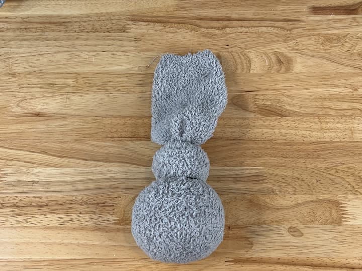 I added 2 rubber bands to create a body and a head.  This will hold the bunny form in place.