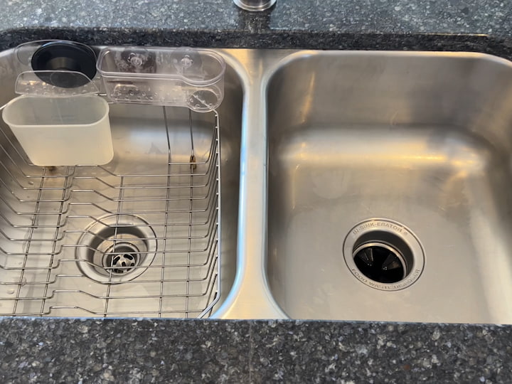 After the sink has been scrubbed, I rinse the whole thing clean.