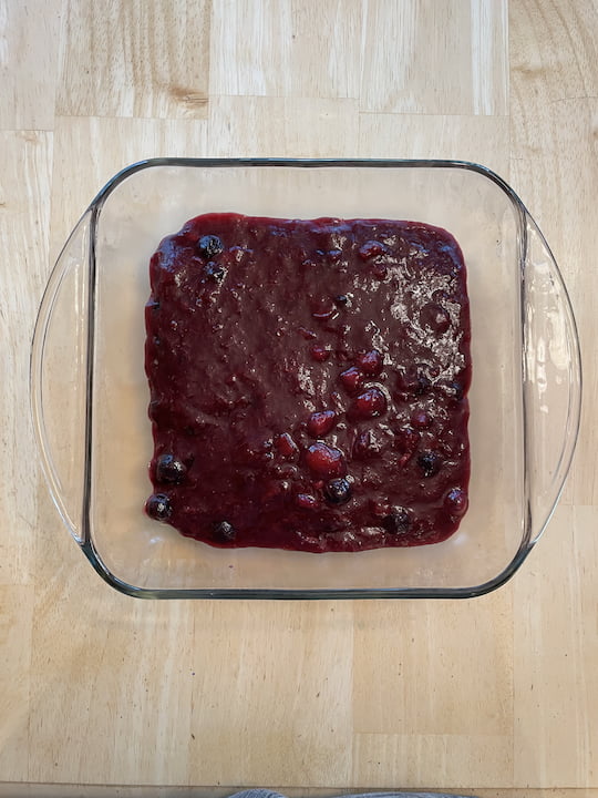 I placed graham crackers on the bottom of a square baking dish and poured the compote mixture on the top. I placed it in the refrigerator to set and cool.