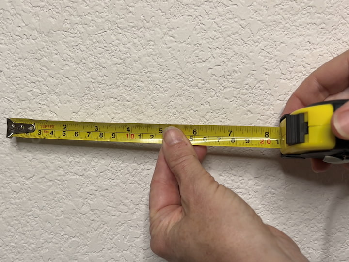 2. Measure and mark the wall surface