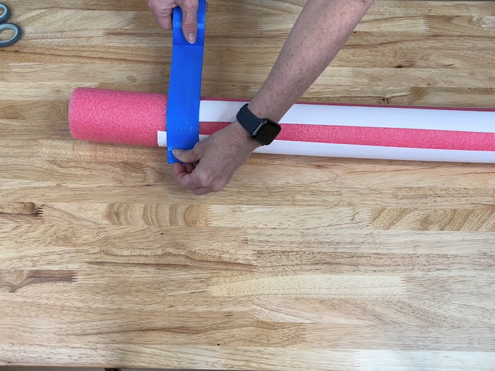 I added blue duct tape to the top of the pool noodle to create the blue section of our flag.