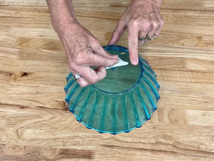 I removed the labels from the bottom of all of the bowls I would be using. It's important to remove as much as possible as the bowl will become the top of your garden mushroom, and the solar panel will need to get clear access to the sun through the bowl.