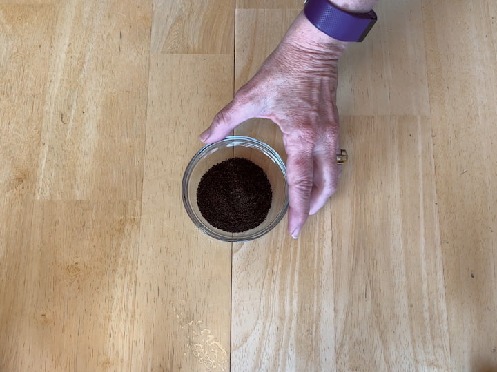 1. Place coffee grounds in a small bowl
