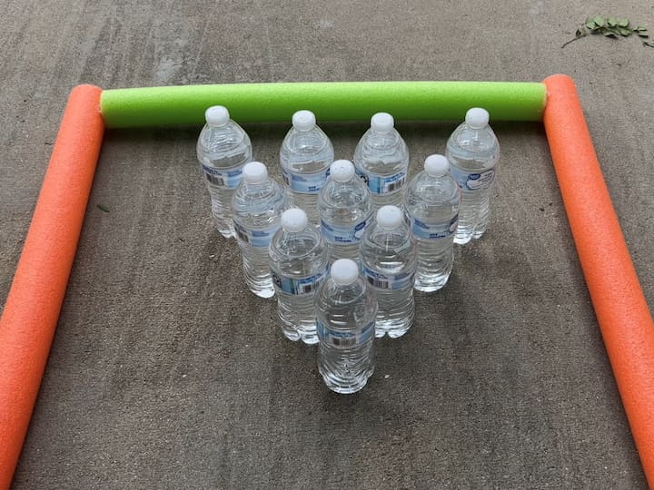 I placed 10 water bottles up like bowling pins.  You can use used water bottles and just put a little bit of water in them for weight.  You can also use old pantry cans or pop cans as well.