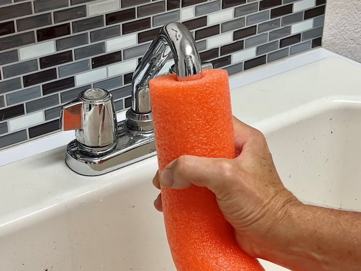 I started by placing one end of a pool noodle on my faucet.