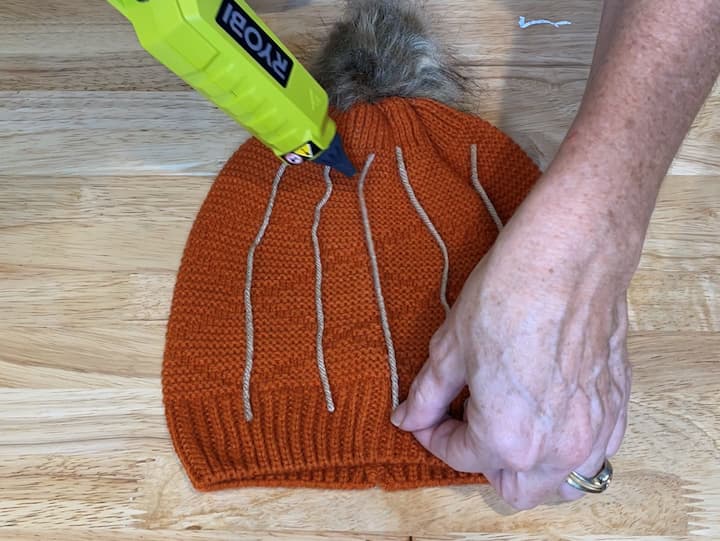 1. Cut Yarn and place it onto the hat