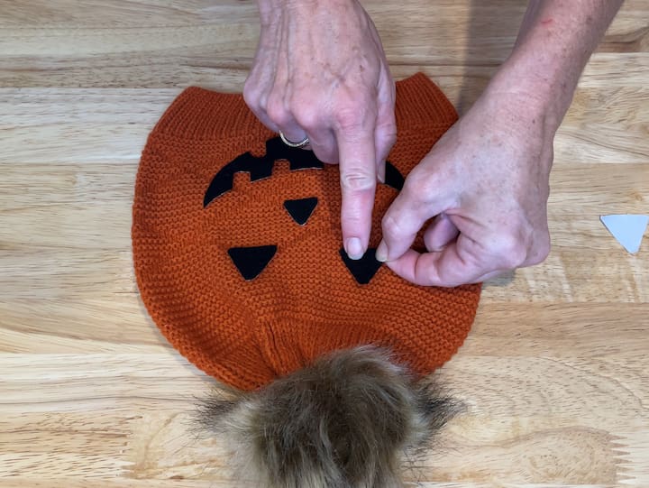 5. Peel the backing off and stick the felt onto the hat.