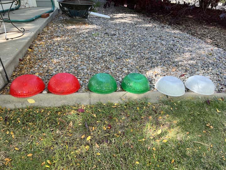 I'm going to paint two of the bowls white, two bowls green, and two bowls red. I will let all of these dry completely before moving on to the next step.