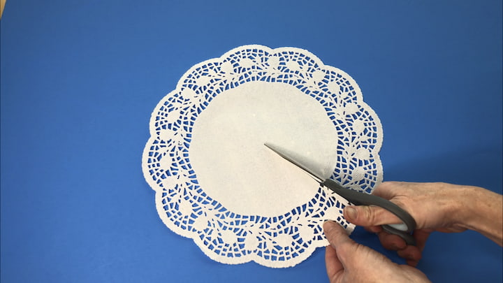 I started by cutting a slit in a doily.