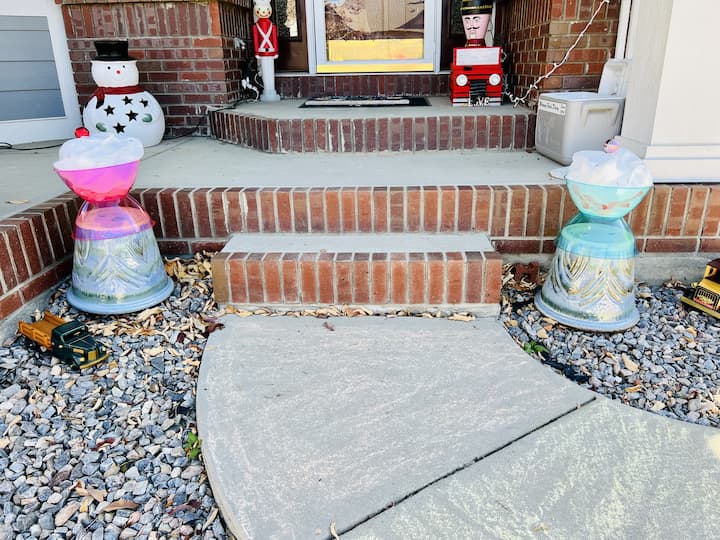 Now it's time to put everything in place. I placed the lollipops alongside my walkway and the sundaes on either side of my front door on upside down flower pots. I took my paint pens and added a few dashes as sprinkles on my ice cream.