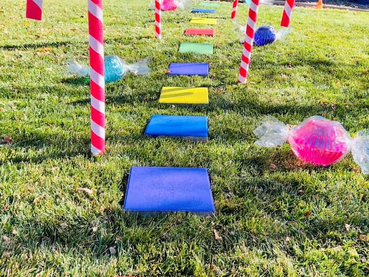 Last year I made this hopscotch with pavers and paint. I'm placing those in my yard now to create this Candyland display. 