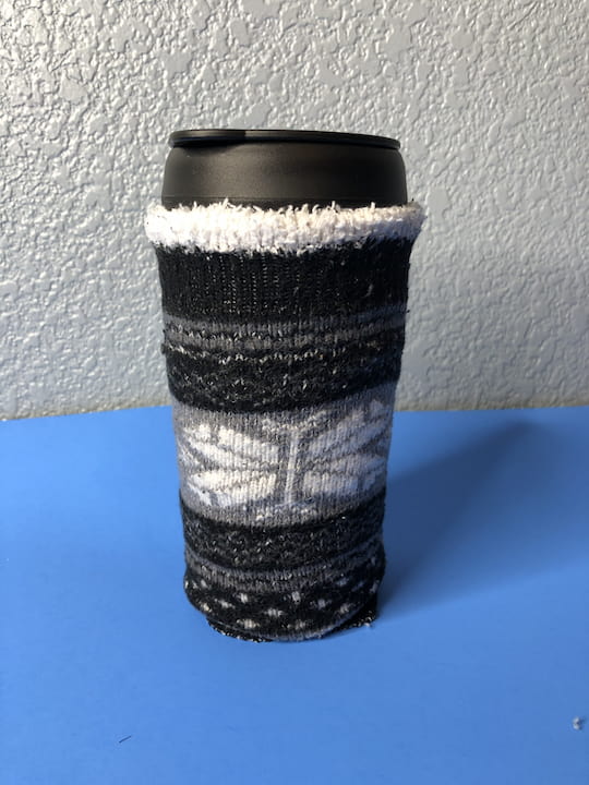 I slid the sock onto the mug and this was a longer design so it covered the entire mug. Long or short you have two different options either a shorter cozy or a long one.