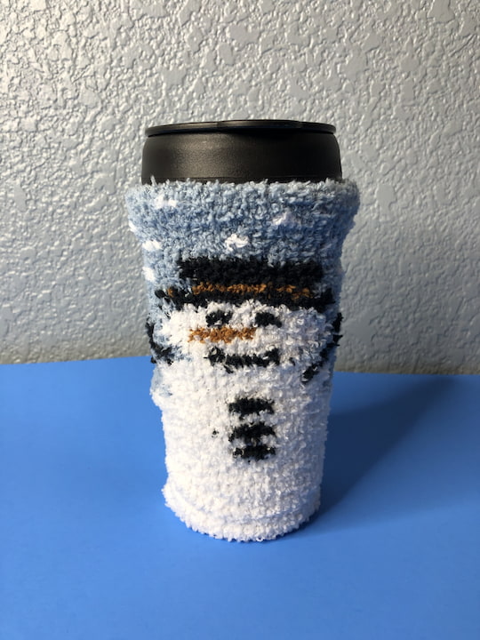 Are you looking for a coffee cozy? Here is an easy no sew DIY made with Dollar Tree items and it makes a fantastic gift.