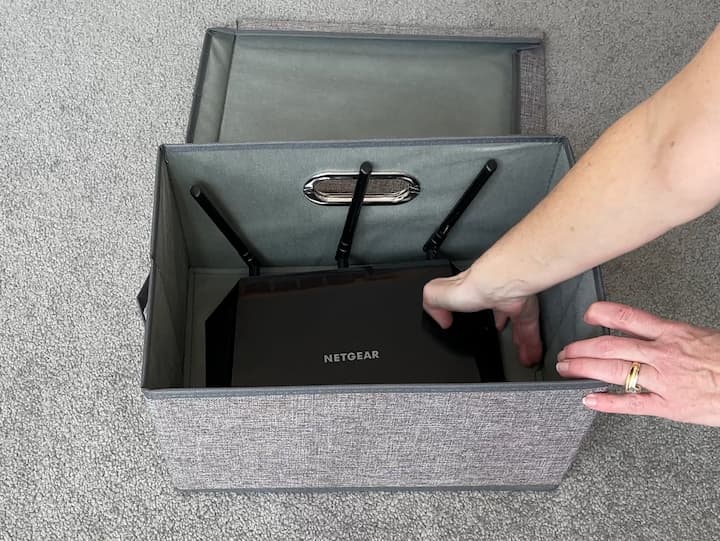 There are many shapes and sizes of the router box as well as other electronic devices, but I have found one thing that works pretty much for all of them. I measured my router and I purchased these collapsible bins. 