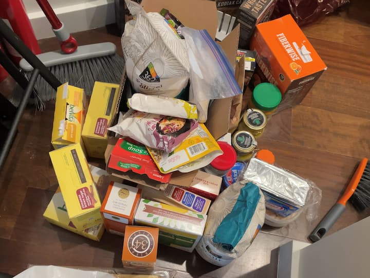 Next, I made a pile of odds and ends that needed to be sorted. Here's a quick look at what was left after I went through everything. Now it was time to have fun organizing the pantry items and creating a space that would give her easy access.