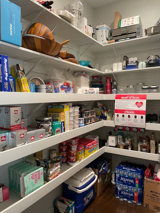 Here's a quick reveal of what the pantry looked like when I was done. The big thing I needed to do was arrange the pantry storage in a way that was successful for my friend. If I organized it the way I wanted it to it might not have been a way that functioned for her. We talked about the way she envisioned her pantry being organized and her priorities for utilizing the shelf space. 