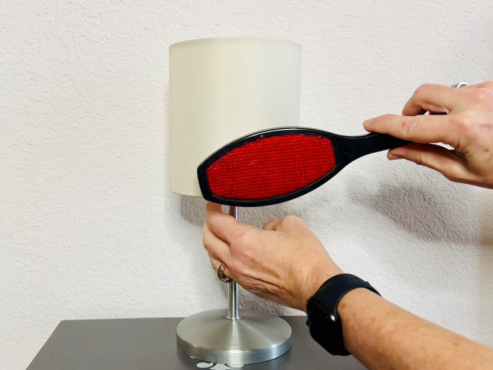 Let's talk about lamp shades and you can easily use a lint roller to clean these off easily.  If you want to be more eco-friendly you can use a reusable lint brush as well. You can find those at the dollar store.
