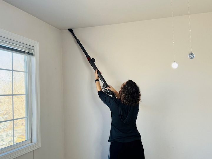 In addition to that, I can get the cobwebs down with this extension as well or high to reach places like above doors or above windows and you just simply suck it off and it's really easy you have one item that cleans everything.  