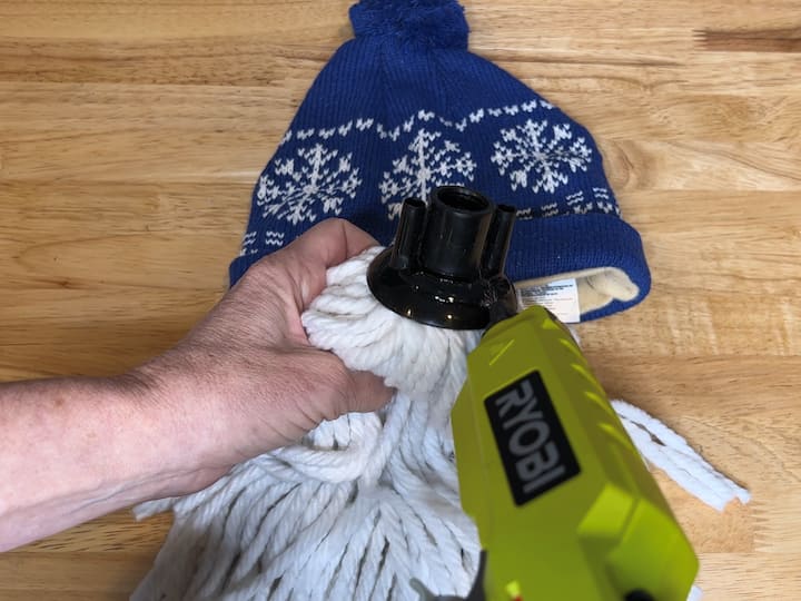 1. Glue the mop Into The Hat