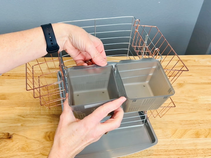 They also sell small plastic bins in sets of three in a variety of colors.  I chose gray to match the silver of the backing rack.  They have a little lip so they hook right over the top of the baking rack.   
