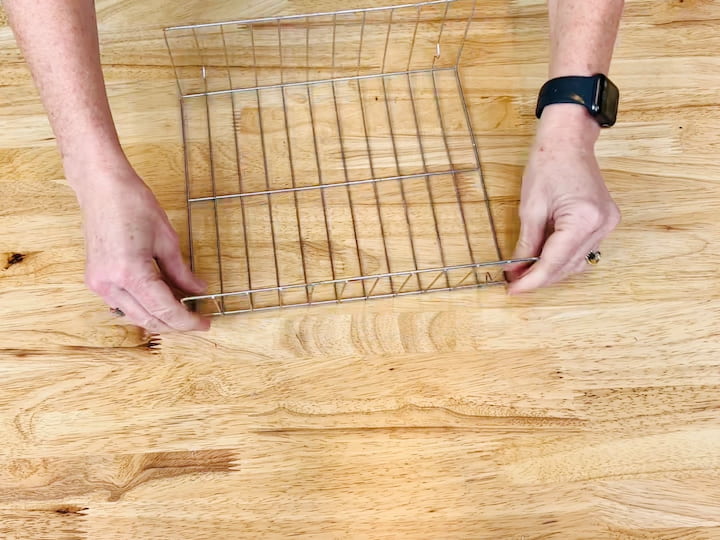 6.  Bend the sides of the cooling racks at a 90 degree angle