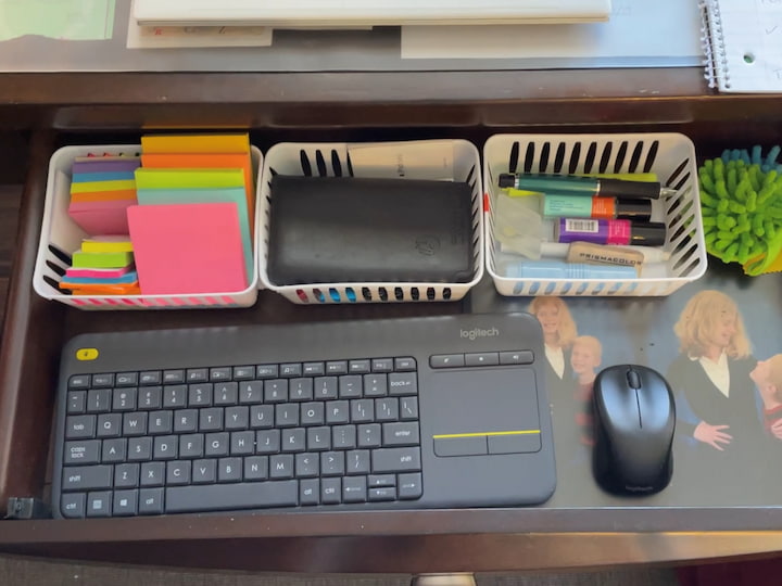 This is my drawer it opens up and it has my keyboard in it for typing for the computer. I have organized trays here because I had some extra space to work with that I used my Post-It notes, my calculator,  my pens and pencils, and then these are little dusters.
