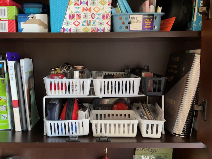 In my office, I use one of the dollar store shelves to create more space here. A lot of times we have deep shelves or high shelves that are wasted space so by buying these shelving units you can give yourself some more space. 