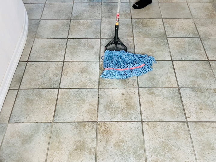 Next, get a clean bucket of water and mop your floor with a warm water rinse. The great thing about this is you can take the mop off and wash it and reuse it each time with a clean mop.