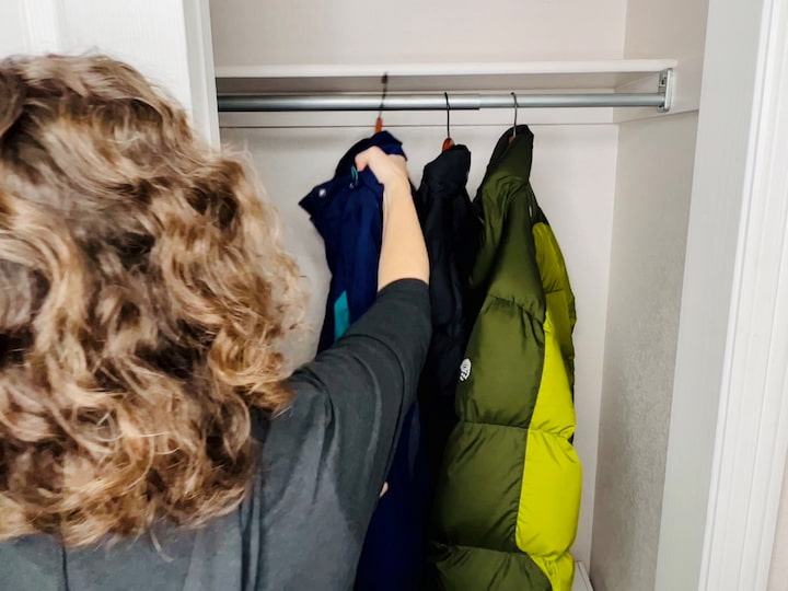 Now as I mentioned it's winter so I'm going to be placing at least one coat for each person back in the hallway closet. 