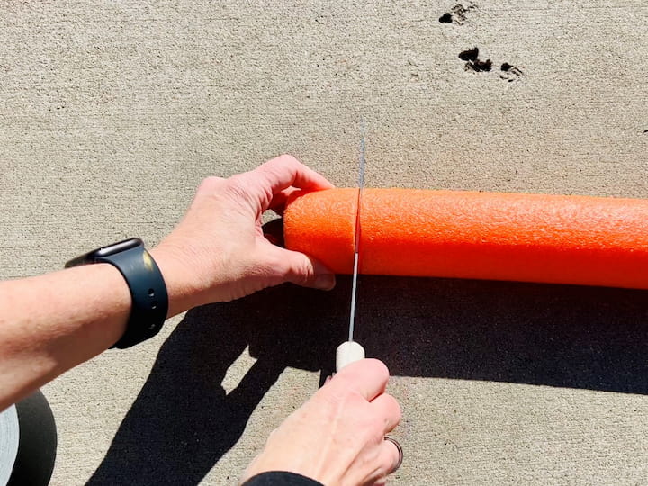 9. Cut and prep a pool noodle for added stability for your DIY solar light post