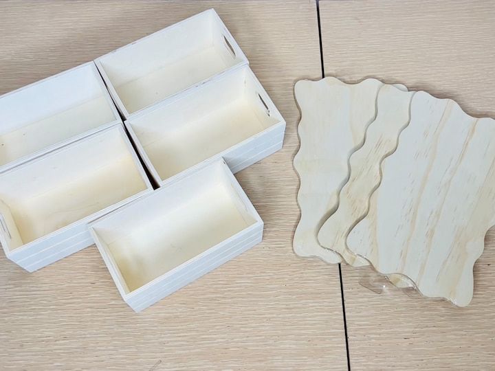 For this project, I grabbed three wooden blanks and four or five little mini crates.   I placed some wax paper down to cover my surface and I'll be using rubber gloves to protect my hands.