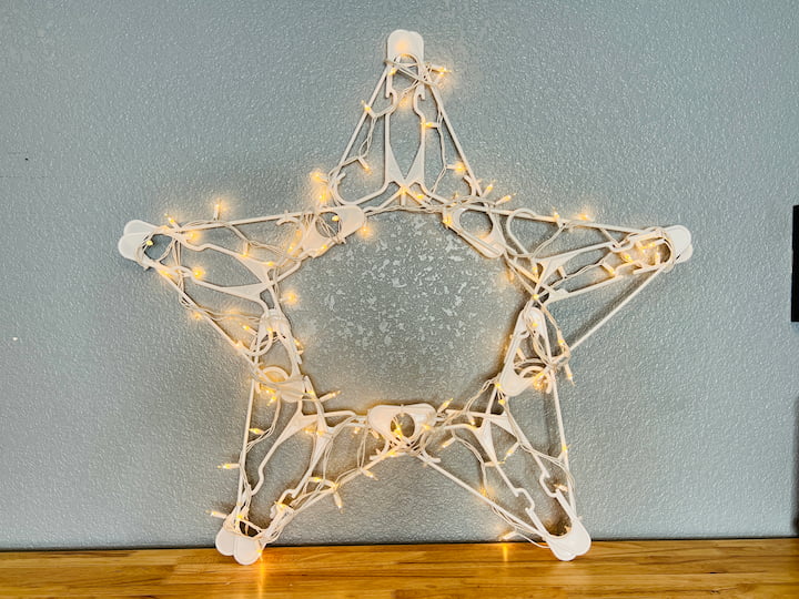 How do you make a plastic hanger star? With just a few supplies from Dollar Tree, I made this easy star on a budget. It even that lights!