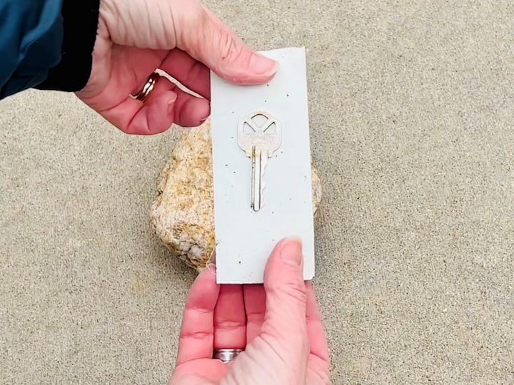 You can also create a hiding space using a rock. Add a key to a piece of tape and put it on the bottom of a rock.