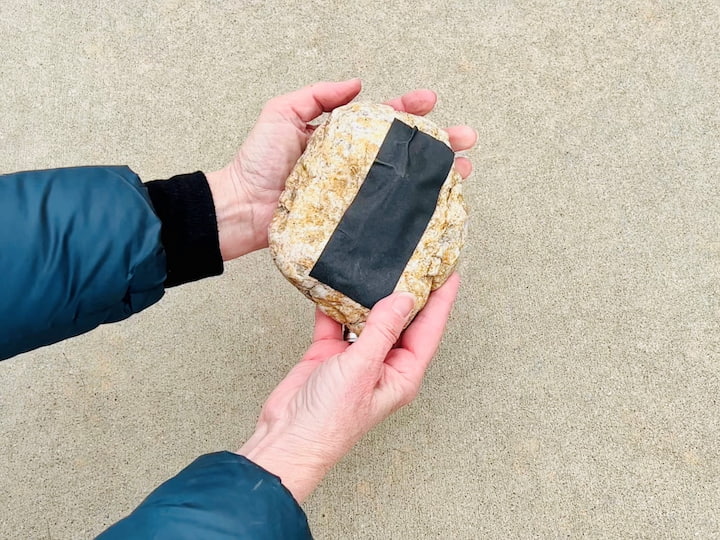 You can also create a hiding space using a rock.   Add a key to a piece of tape and put it on the bottom of a rock.  