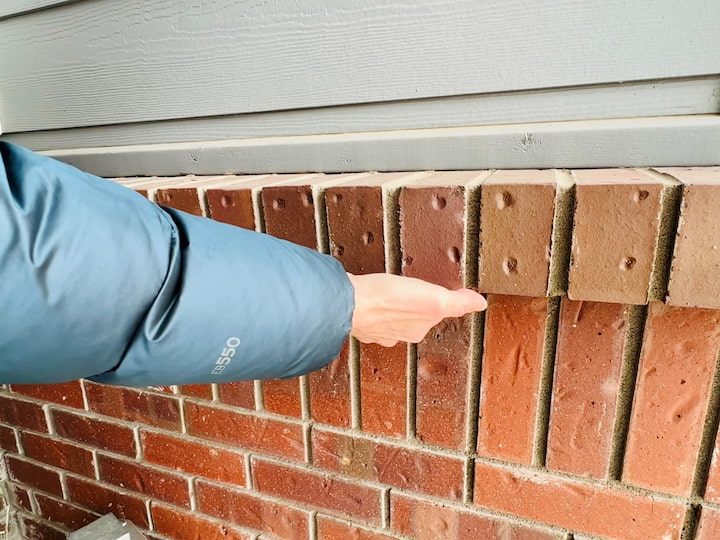 When looking around your house look for places like this brick ledge.   All I had to do was add a piece of tape to a key and I could place it underneath the ledge.