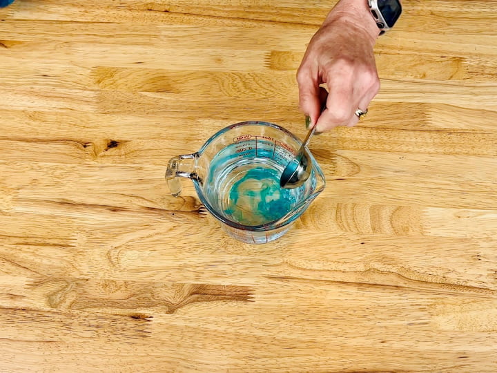 Mix one tablespoon of Dawn dish soap into one cup of water.