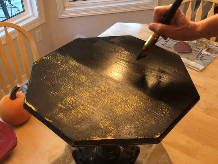 Next, I used Folk Art Home Decor Chalk Paint in Rich Black to paint the entire surface of the table. I let it dry between coats and added a second coat. This chalk paint is water-based, making it easy to clean up any spills.