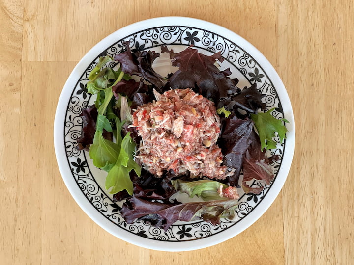 The salad is now ready to serve! You can enjoy it over a bed of fresh Red Leaf or Spring Leaf mix, or you can serve it on bread for a delicious sandwich.
