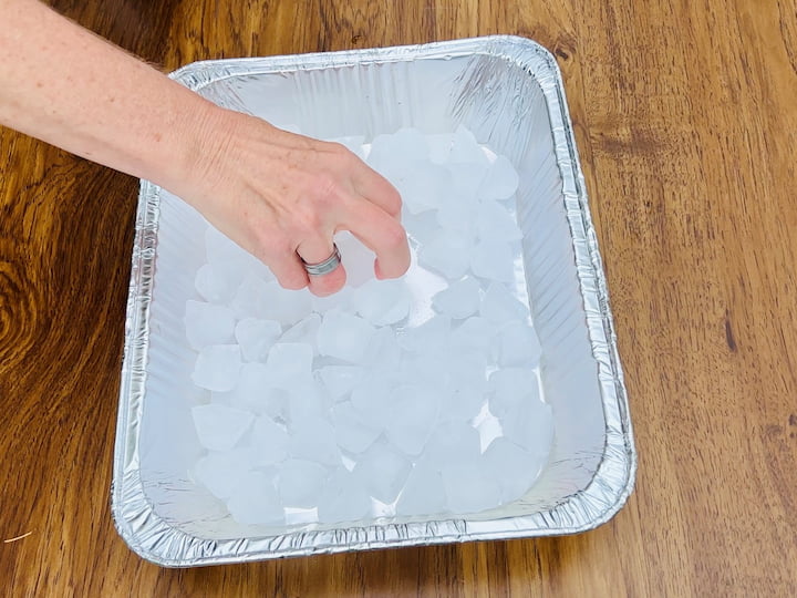 Use a muffin tin to organize and display your condiments. It keeps them neatly separated and easily accessible for your guests. For keeping them cool, grab two lasagna pans from the dollar store. Fill one half with ice and place your condiment-filled muffin tin on top. This setup ensures that your condiments stay nice and chilled for your backyard barbecue.