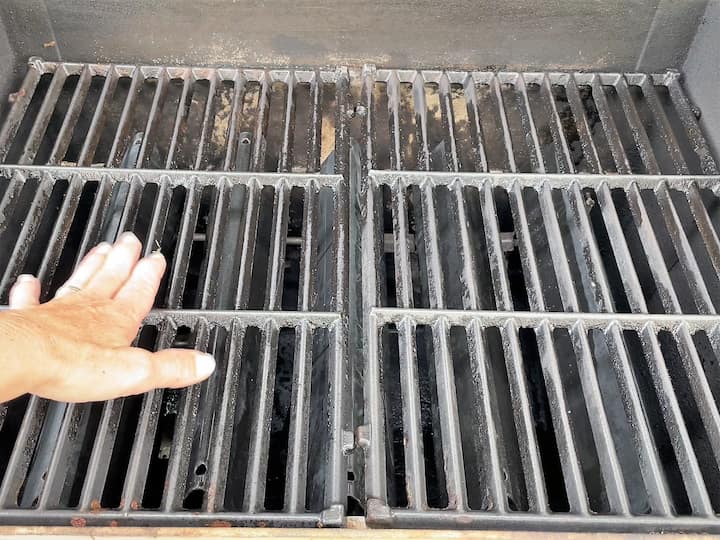 Once all of the grates were cleaned, I rinsed them off and placed them into the grill.
