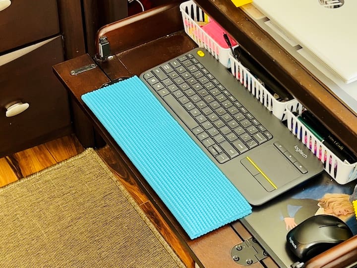 Create a wrist rest for your keyboard. Measure your desk size, cut the mat accordingly, fold it in half, and hot glue the three edges closed.