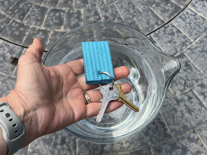 Make a floatable keychain by cutting a small scrap of yoga mat, folding it in half, and gluing the edges. Punch a hole through it and attach a keychain.