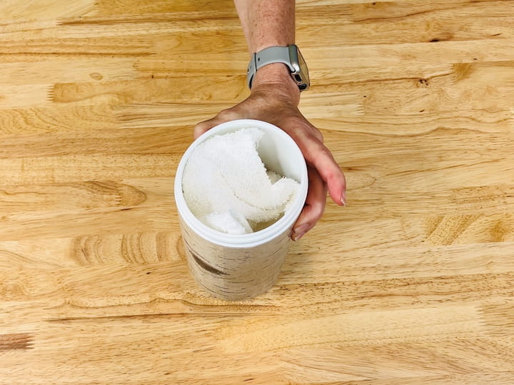 If you prefer wipes, grab an empty container and place several washcloths inside. Pour the Castile soap mixture over the top of the washcloths, making sure they are damp. Now, whenever you're ready to use a wipe, pull one out and wipe your yoga mat clean with it. You can launder and reuse these wipes.