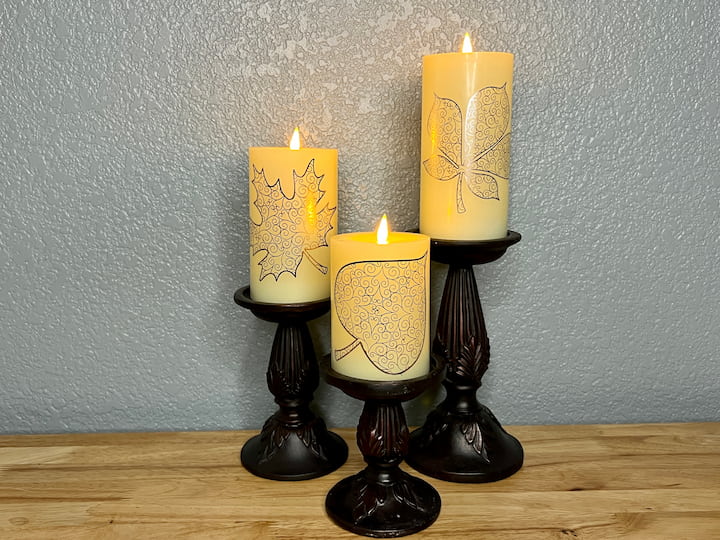 Now, sit back and admire your beautiful fall-inspired candle holders. These decals can be easily removed at the end of the season, allowing you to update your candles for the next occasion.