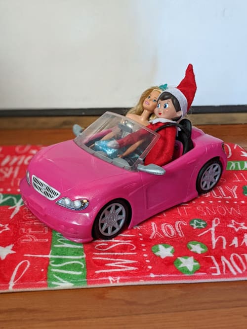 Elf on the Shelf Driving Around With Barbie